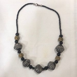 Black and white West African clay and metal bead necklace